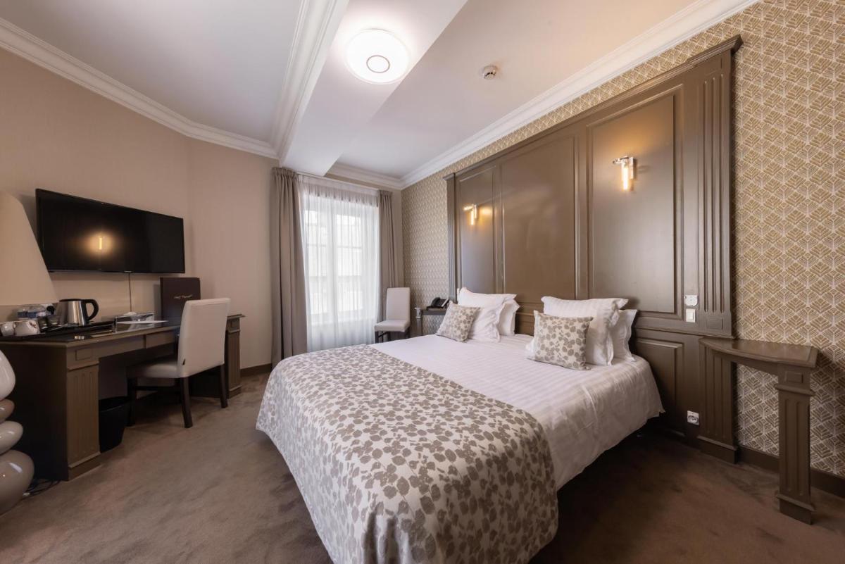 Un ou plusieurs lits dans un hébergement de l'établissement Grand Hôtel du Luxembourg & Spa