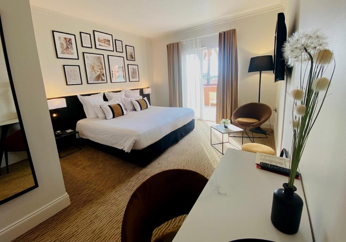 Un ou plusieurs lits dans un hébergement de l'établissement Palmyra Golf Hotel & Spa