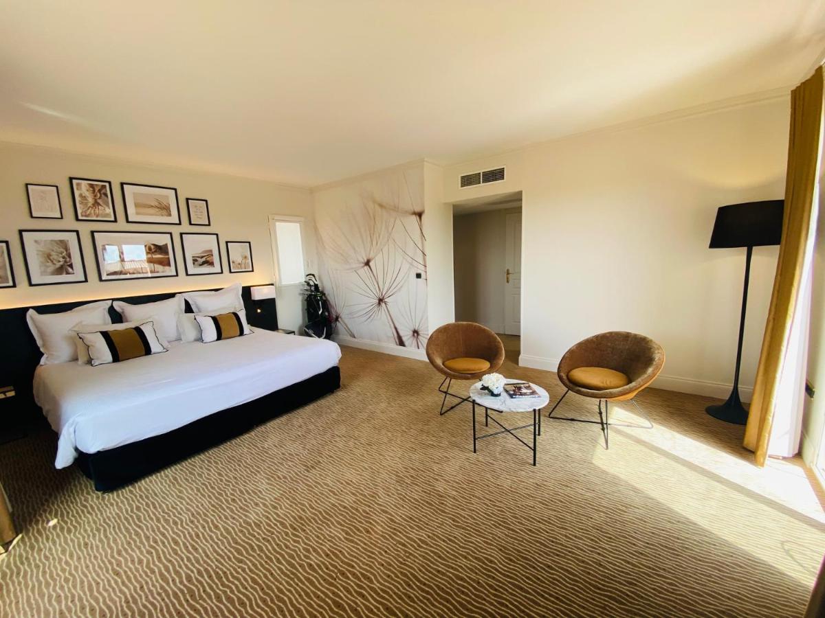 Un ou plusieurs lits dans un hébergement de l'établissement Palmyra Golf Hotel & Spa