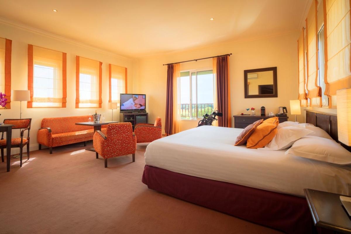 Un ou plusieurs lits dans un hébergement de l'établissement Palmyra Golf Hotel & Spa