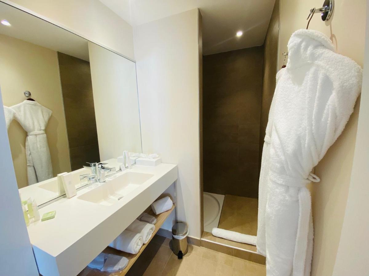 Salle de bains dans l'établissement Palmyra Golf Hotel & Spa