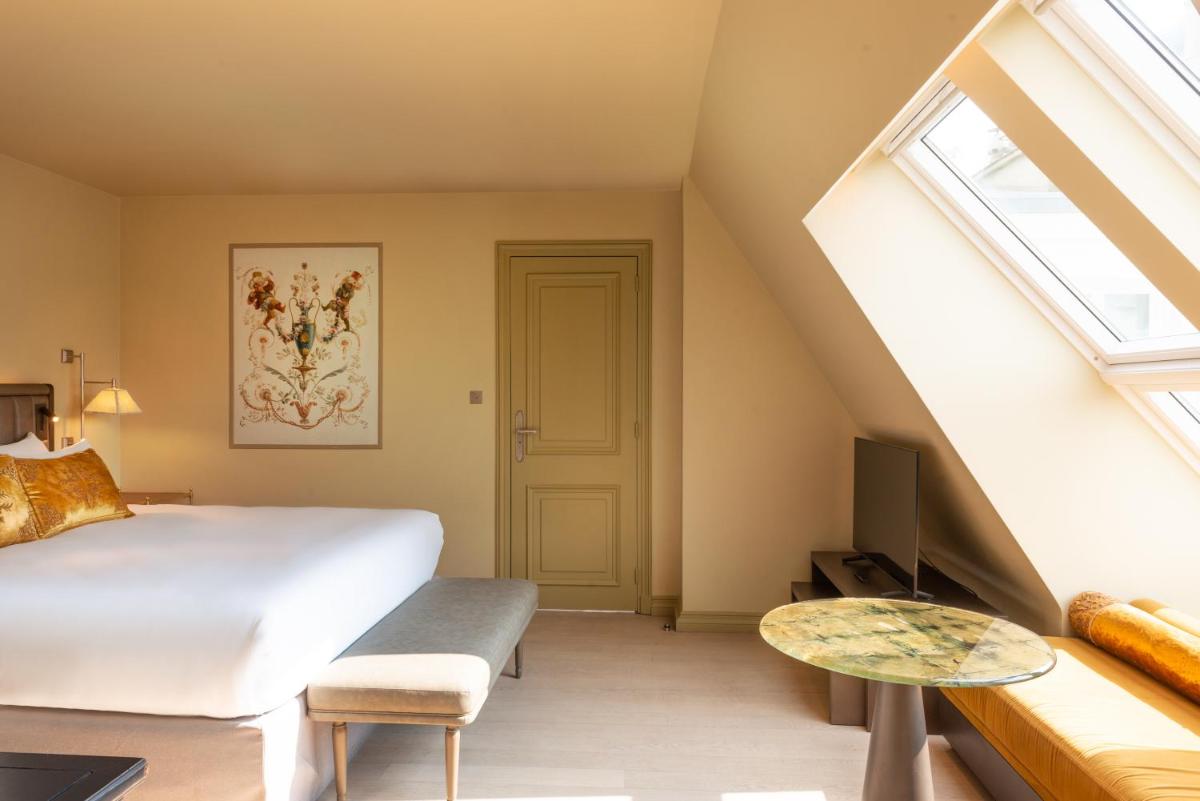 Un ou plusieurs lits dans un hébergement de l'établissement Hotel de Montesquieu
