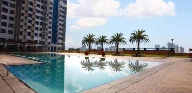 Emma and Jojo staycation condo unit in Mezza Residences - Housity