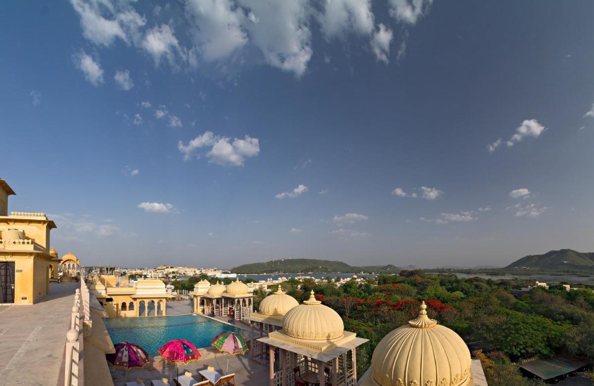 a view of a resort with a swimming pool at Chunda Palace in Udaipur