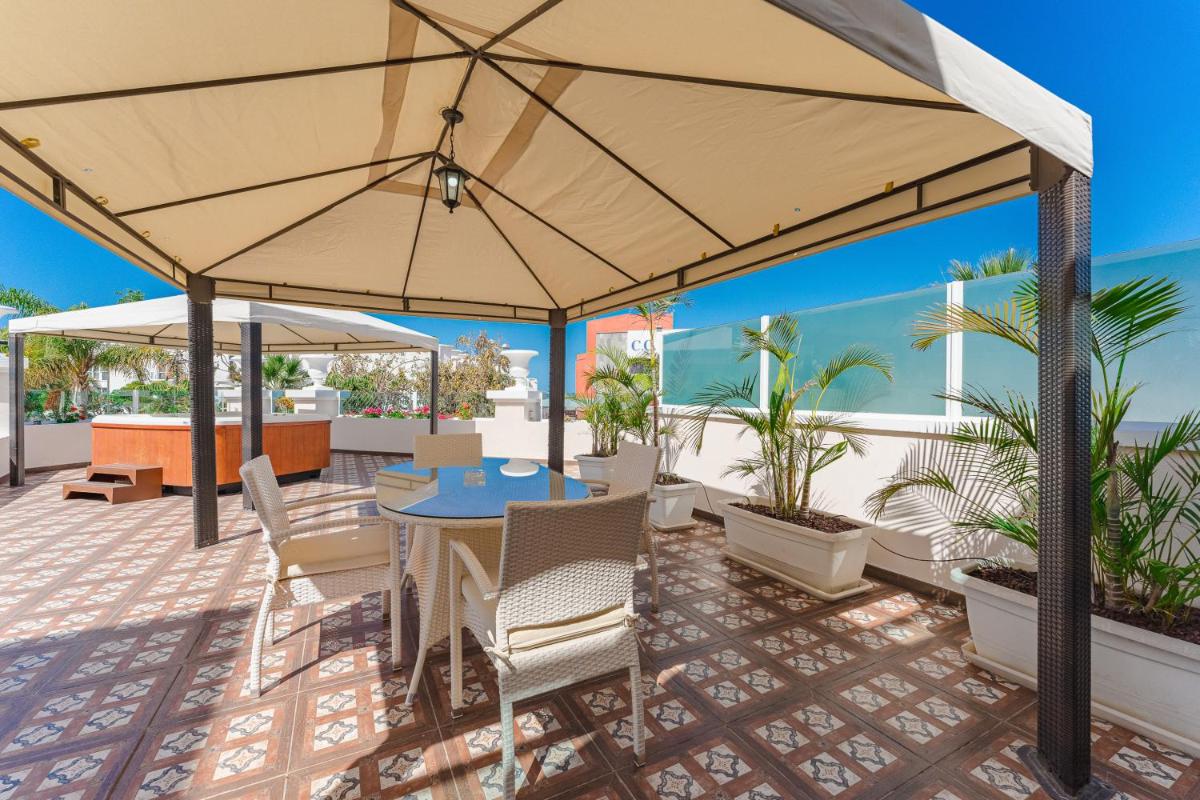 Un balcón o terraza de Flamingo Suites Boutique Hotel