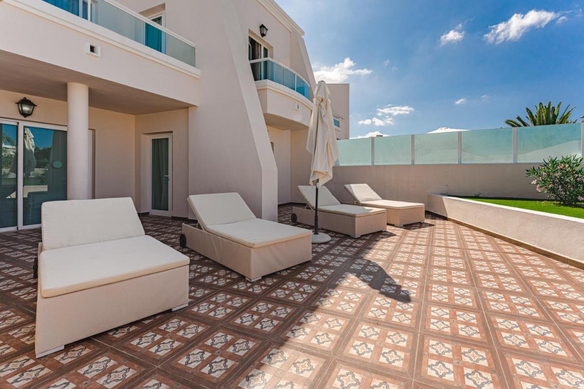 Zona de estar de Flamingo Suites Boutique Hotel
