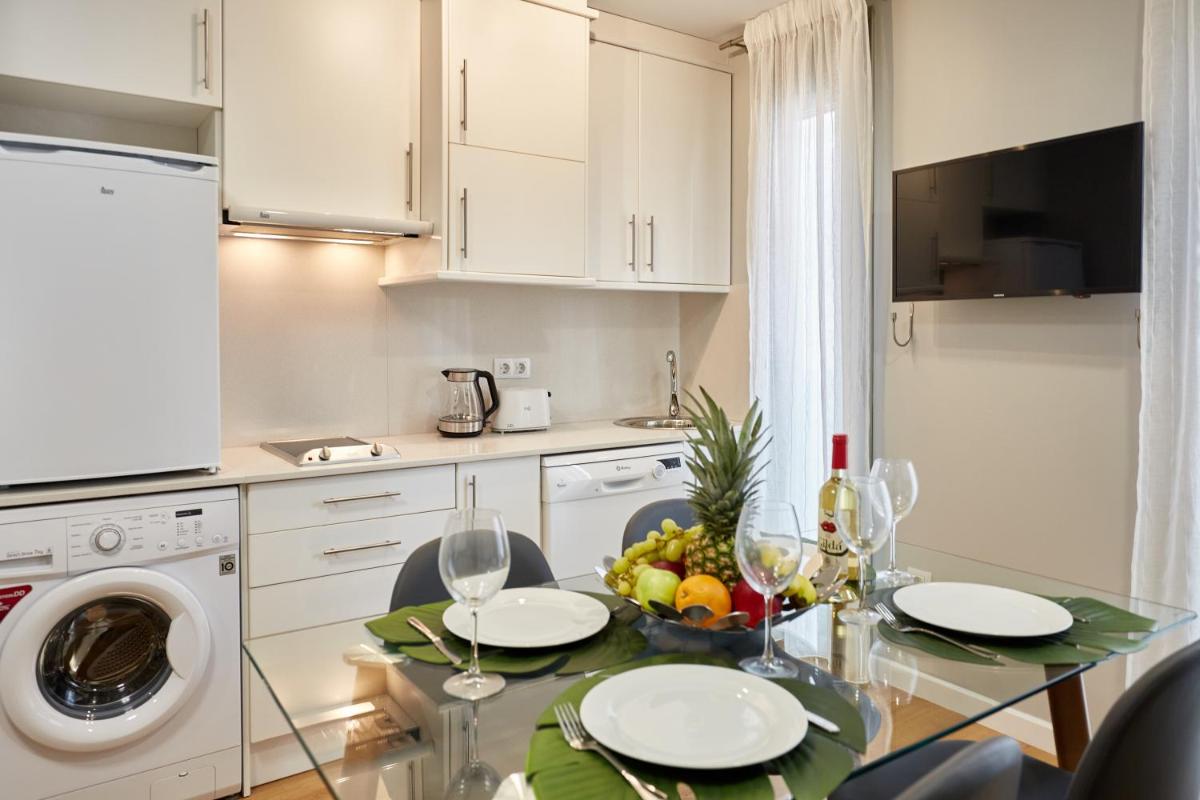 Una cocina o zona de cocina en Apart-hotel Happy Life