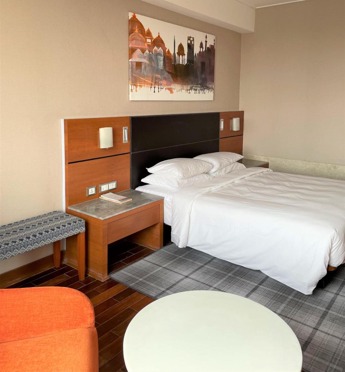 a hotel room with two beds and a table at Hyatt Centric Janakpuri New Delhi in New Delhi