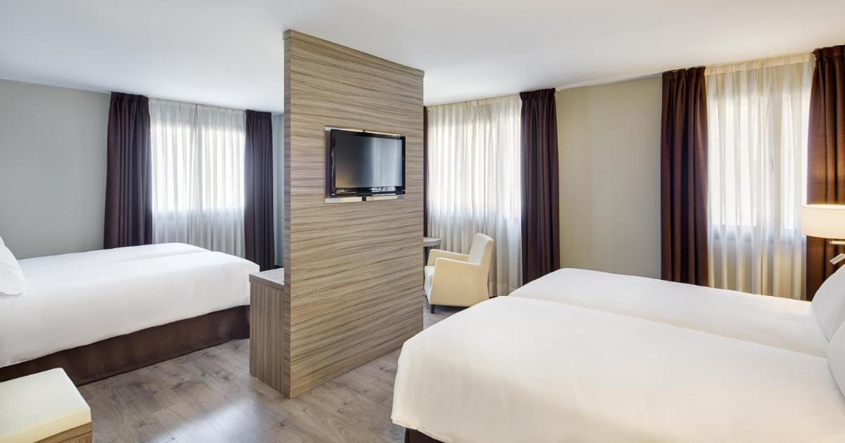 Cama o camas de una habitación en Gran Hotel Luna de Granada