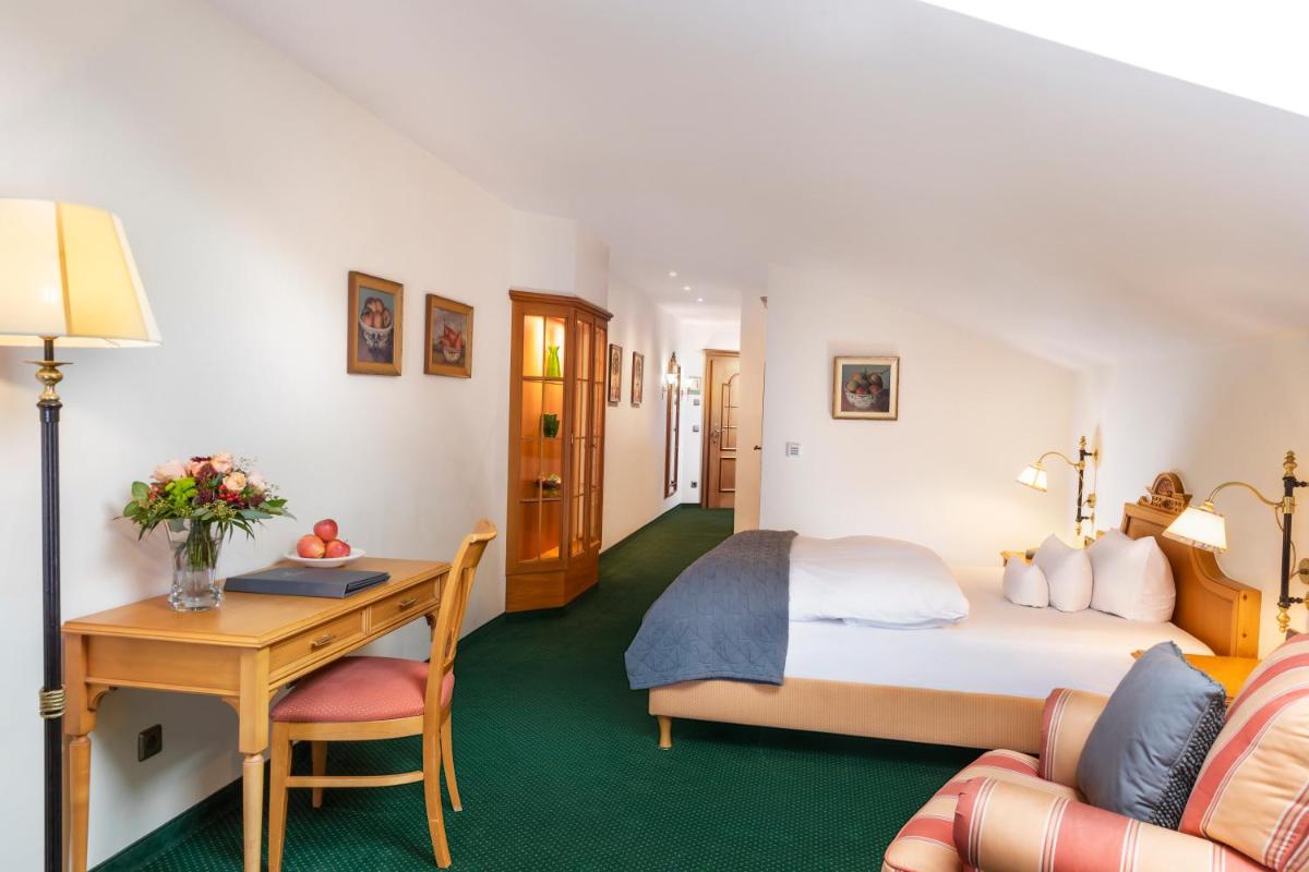 Ein Bett oder Betten in einem Zimmer der Unterkunft Wellness & Genuss Resort - Engel Obertal