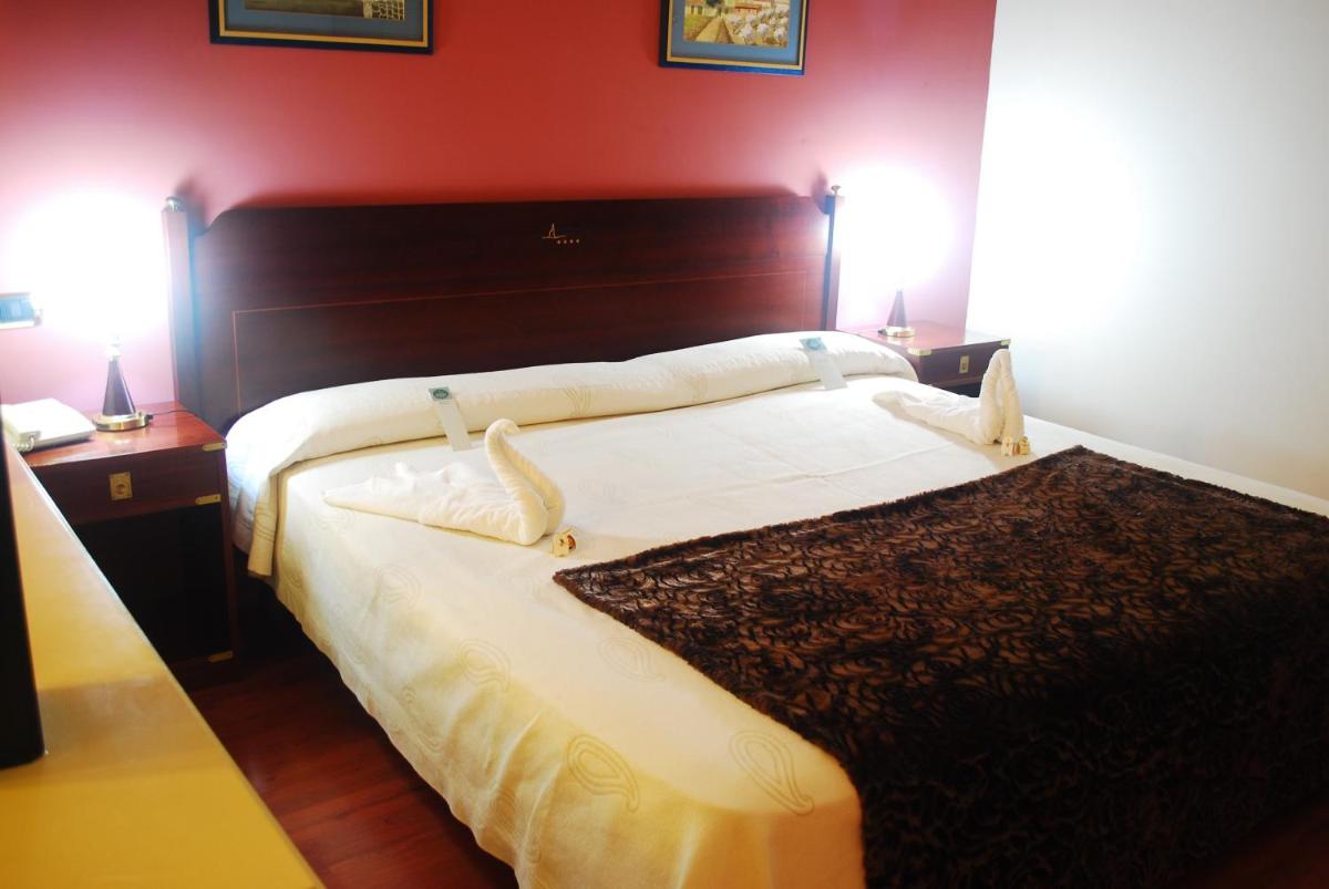 Cama o camas de una habitación en Hotel Puerto de Las Nieves