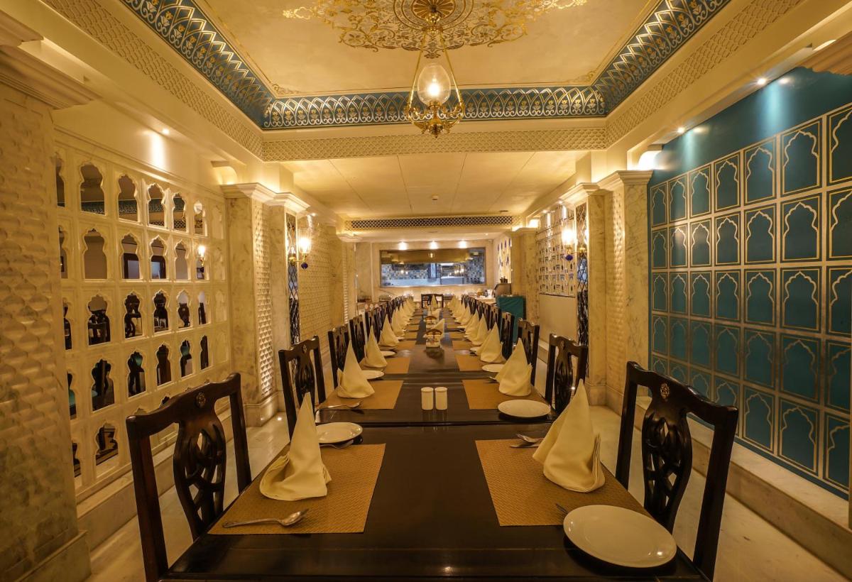 a long dining room with a long table at Shahpura House in Jaipur