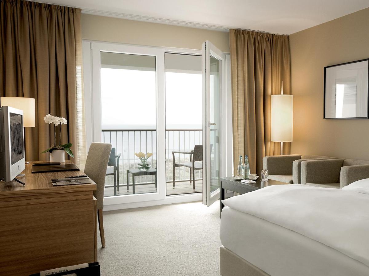 Ein Bett oder Betten in einem Zimmer der Unterkunft A-ROSA Sylt