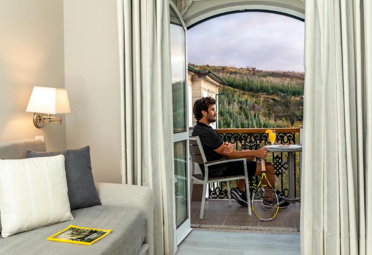 Uma área de estar em Grande Hotel das Caldas da Felgueira