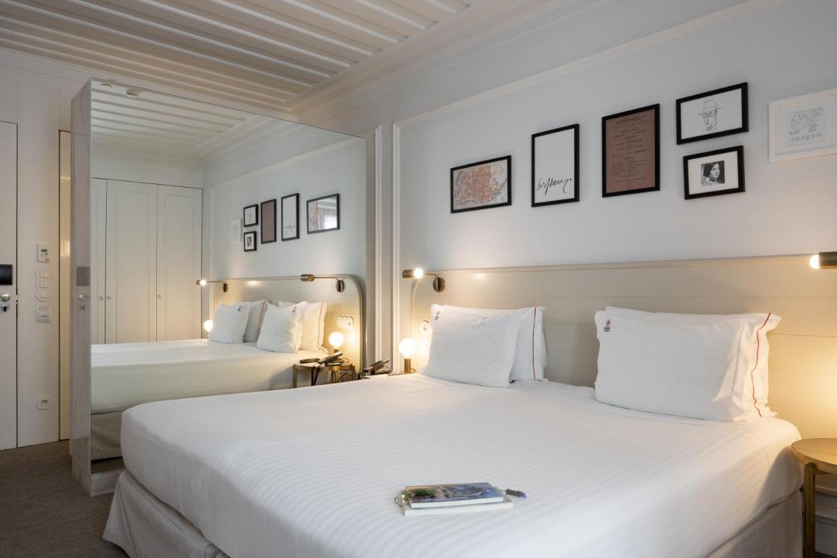 Uma cama ou camas num quarto em Lisboa Pessoa Hotel