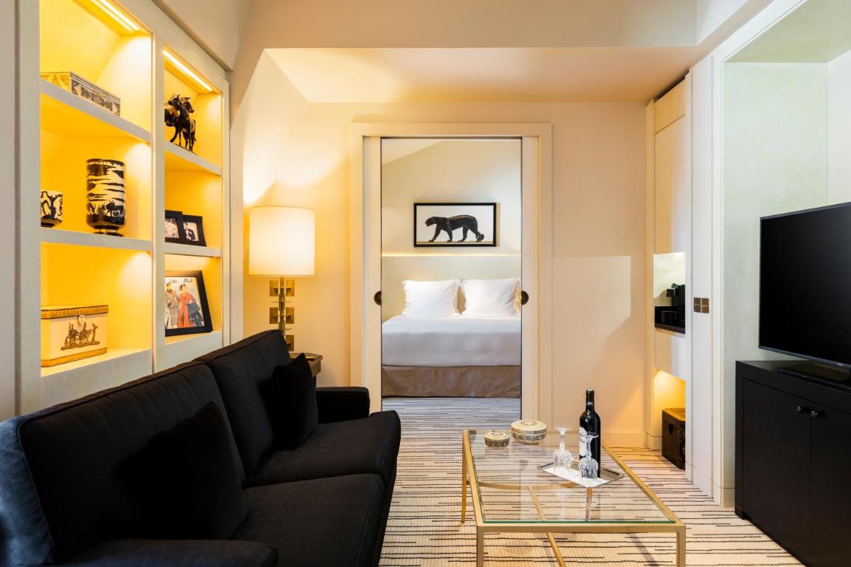 Un ou plusieurs lits dans un hébergement de l'établissement Hotel Montaigne