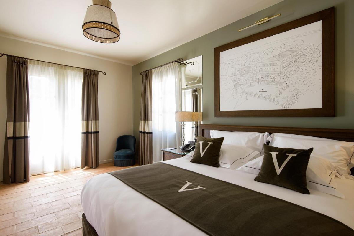 Un ou plusieurs lits dans un hébergement de l'établissement Le Vallon de Valrugues Hotel Spa & Villas