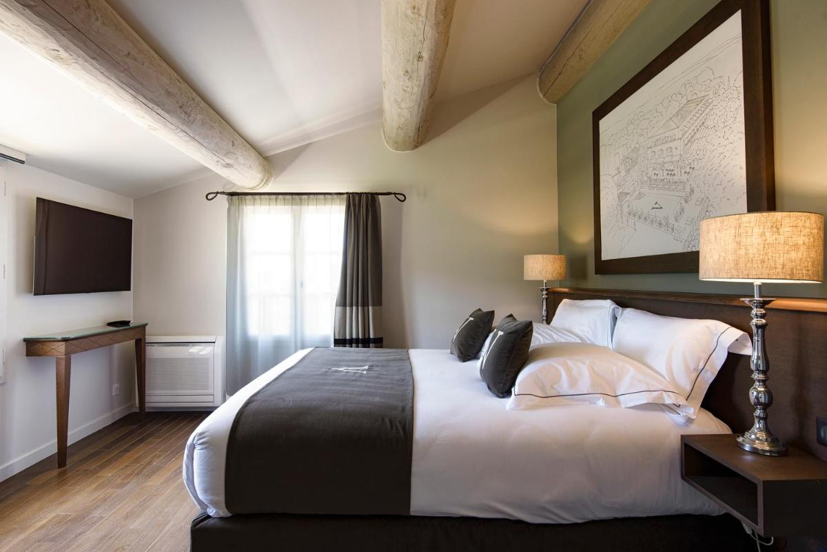 Un ou plusieurs lits dans un hébergement de l'établissement Le Vallon de Valrugues Hotel Spa & Villas
