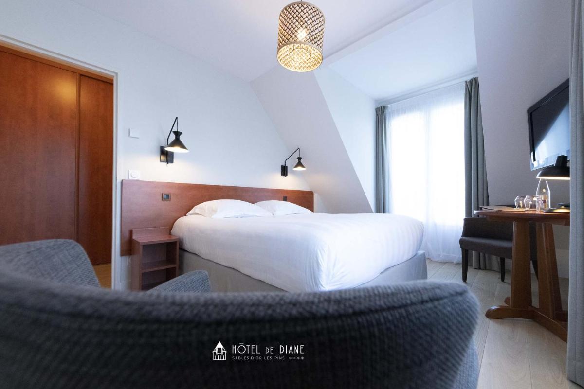 Un ou plusieurs lits dans un hébergement de l'établissement Hotel De Diane