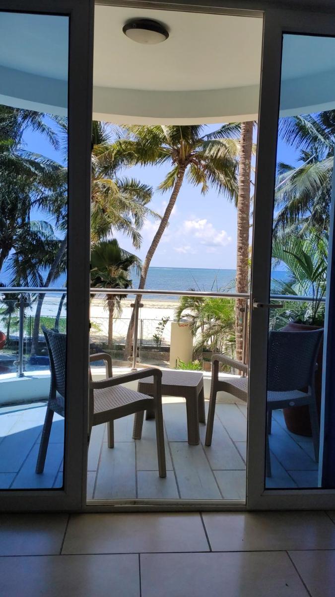 Rosy Sea Front Beach Condo - Housity
