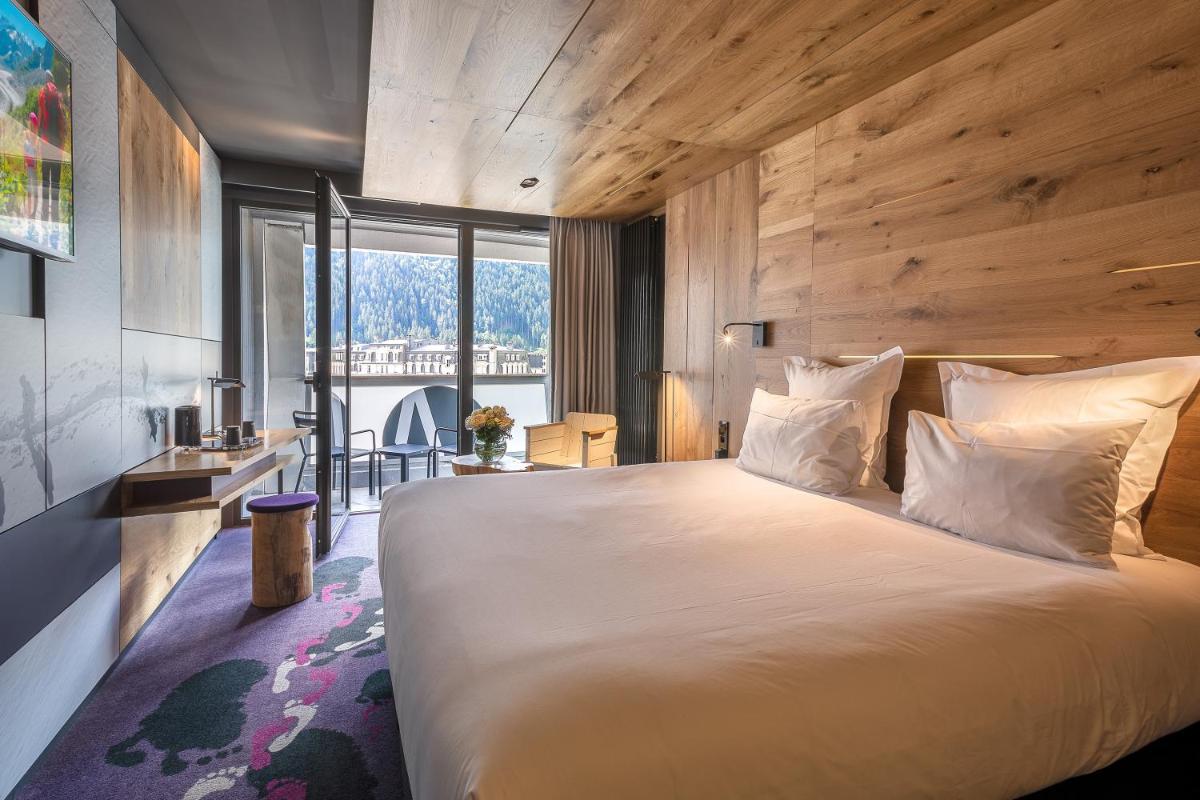 Un ou plusieurs lits dans un hébergement de l'établissement Alpina Eclectic Hotel