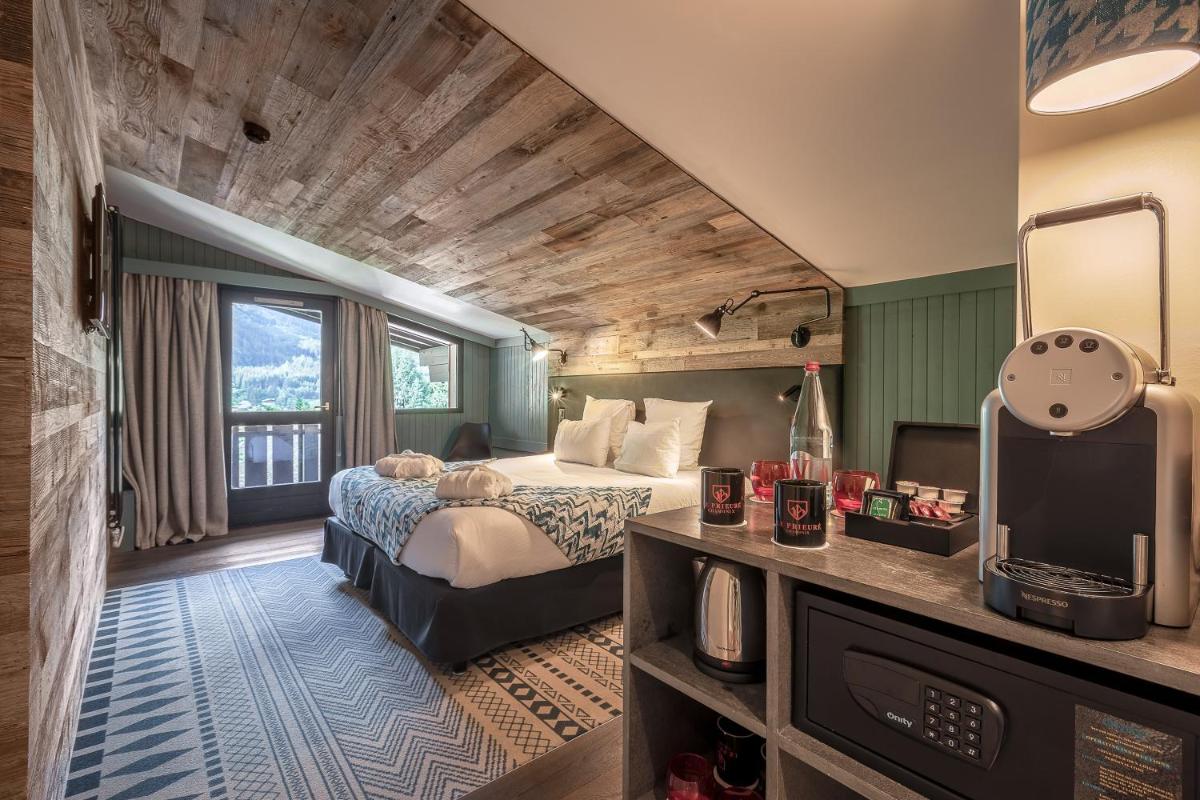 Un ou plusieurs lits dans un hébergement de l'établissement Chalet Hôtel Le Prieuré & Spa