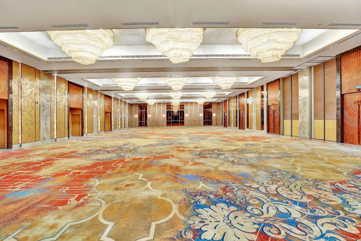 a large room with a large rug on the floor at Radisson RED Chandigarh Mohali in Chandīgarh
