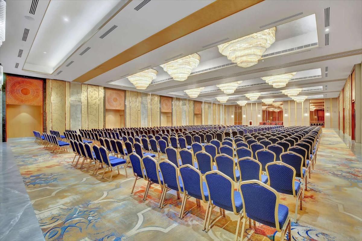 a large room with rows of chairs in it at Radisson RED Chandigarh Mohali in Chandīgarh
