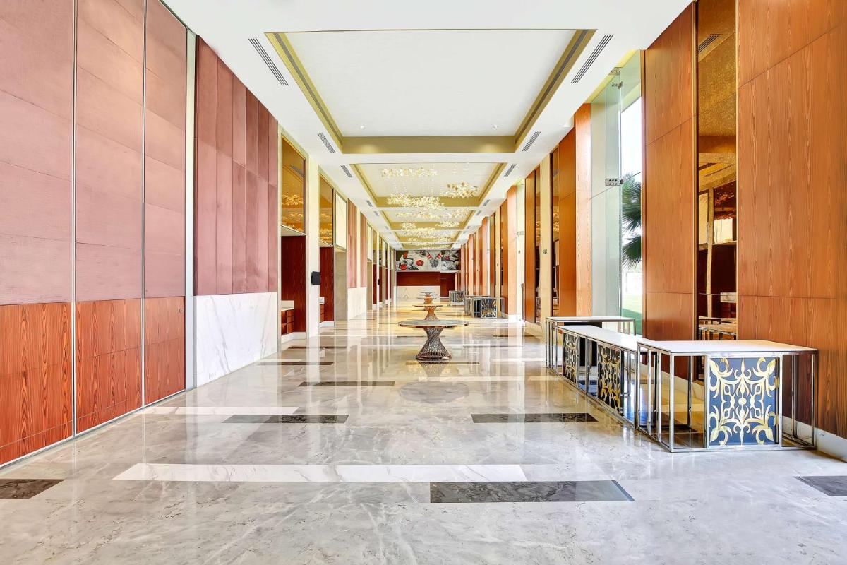 a hallway of a building with wooden walls at Radisson RED Chandigarh Mohali in Chandīgarh