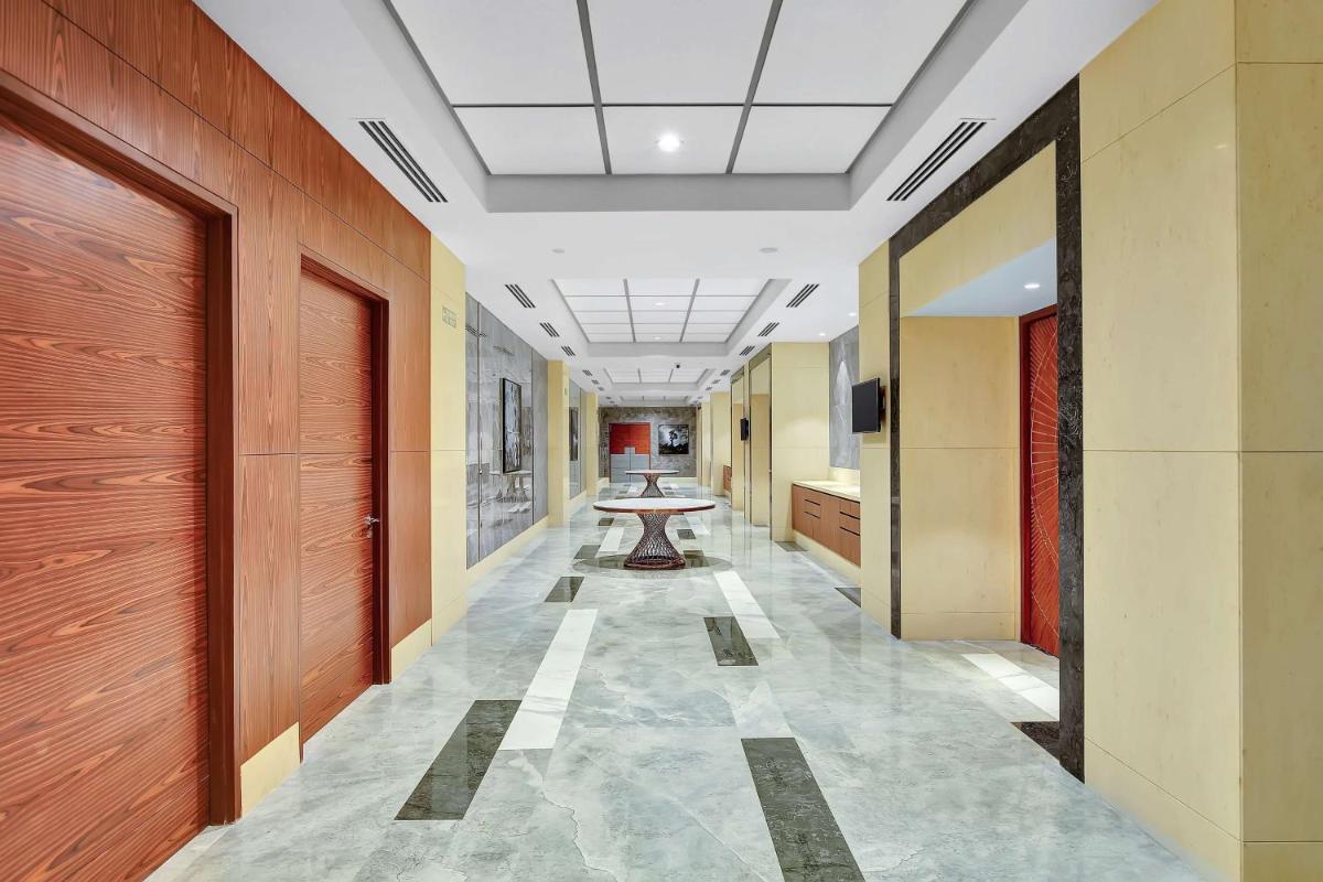 a hallway with a table in the middle of a building at Radisson RED Chandigarh Mohali in Chandīgarh