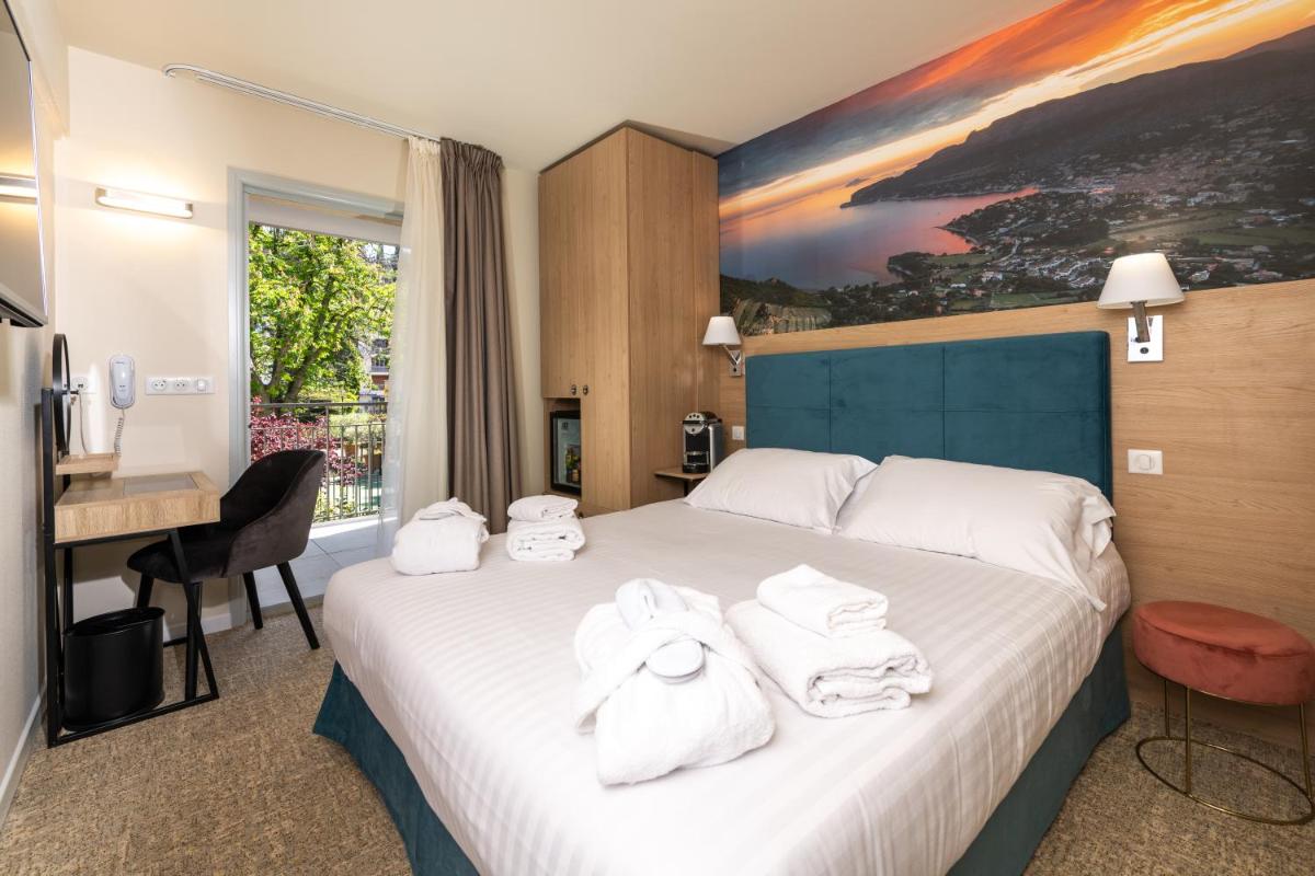 Un ou plusieurs lits dans un hébergement de l'établissement Best Western Hotel & SPA Coeur De Cassis