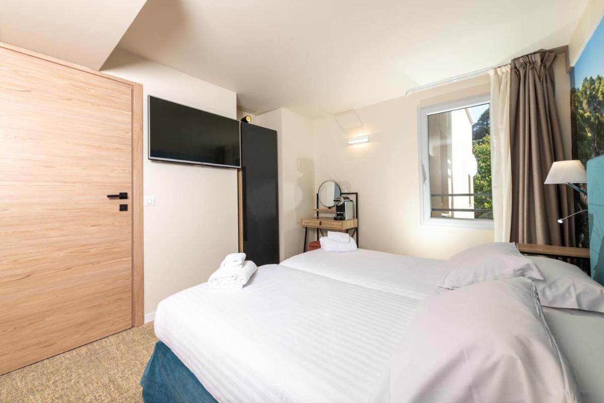 Un ou plusieurs lits dans un hébergement de l'établissement Best Western Hotel & SPA Coeur De Cassis