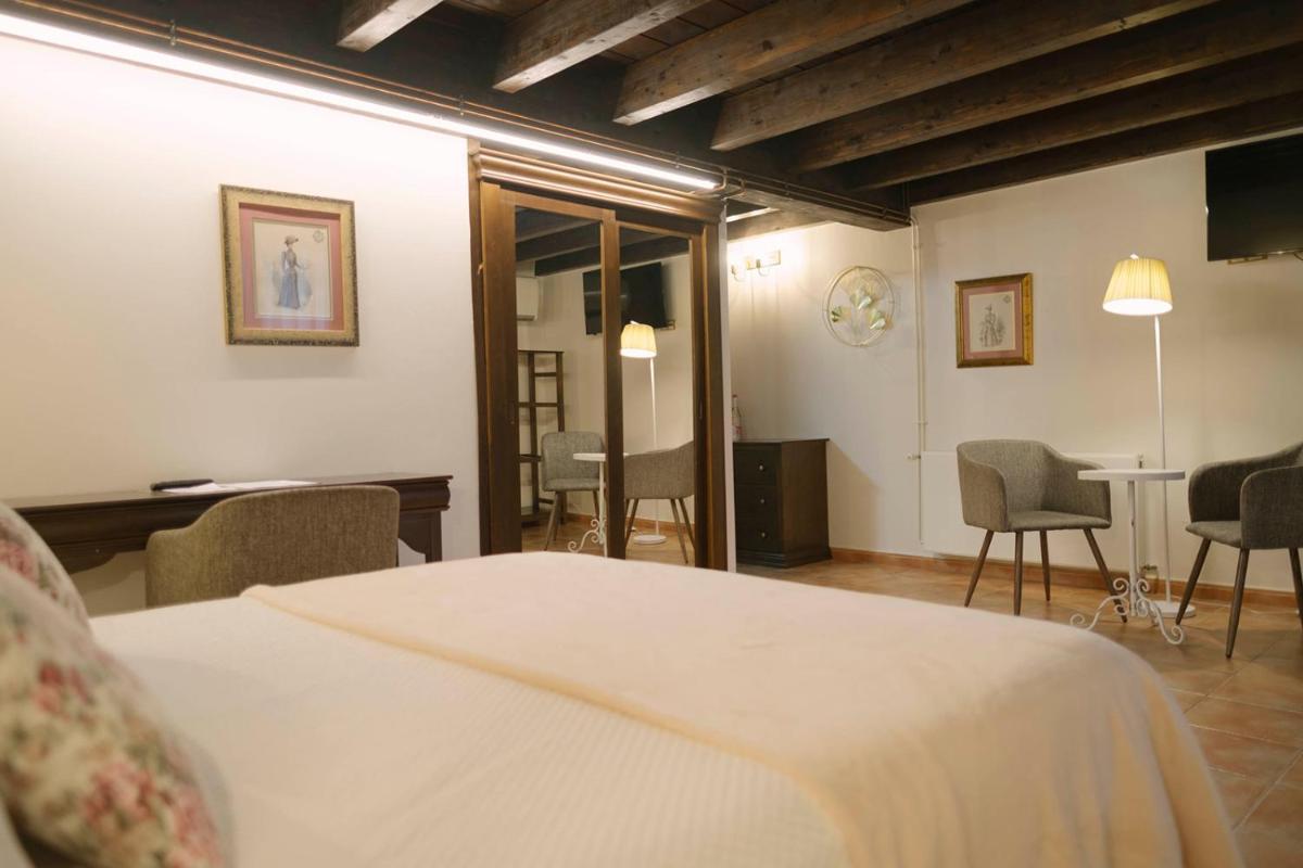 Cama o camas de una habitación en Hotel & Spa María Manuela