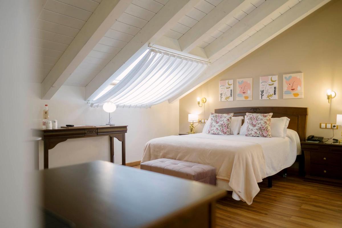 Cama o camas de una habitación en Hotel & Spa María Manuela