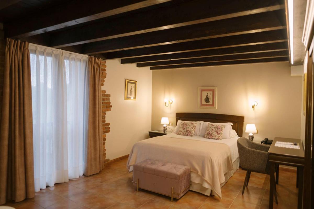 Cama o camas de una habitación en Hotel & Spa María Manuela