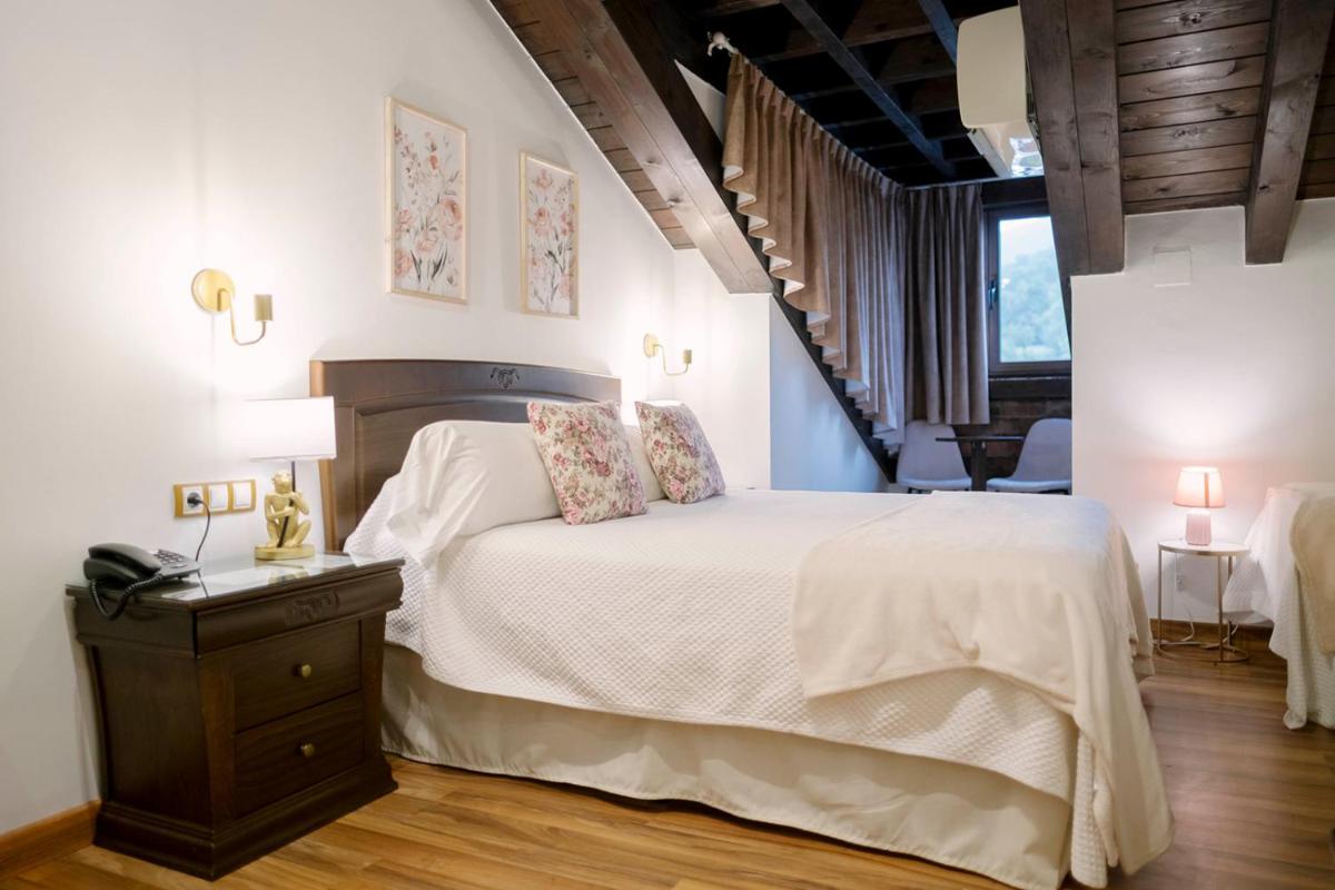 Cama o camas de una habitación en Hotel & Spa María Manuela
