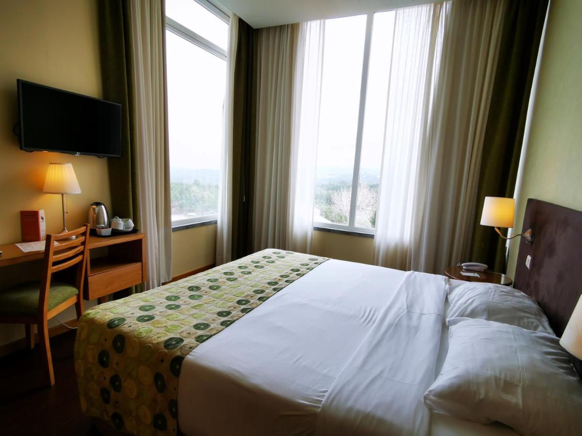 Uma cama ou camas num quarto em Hotel Da Montanha