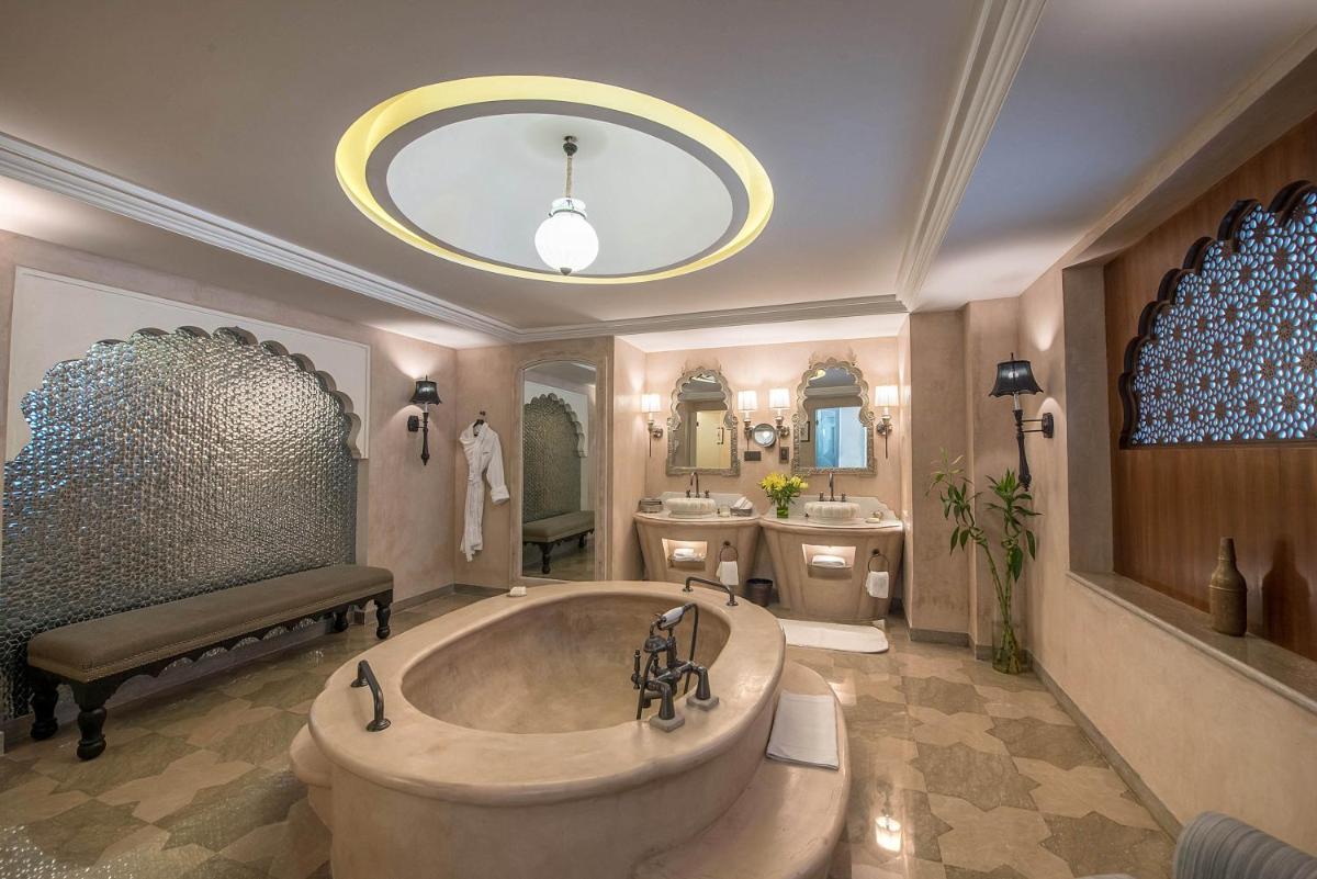 a large bathroom with a tub and a sink at Fairmont Jaipur in Jaipur