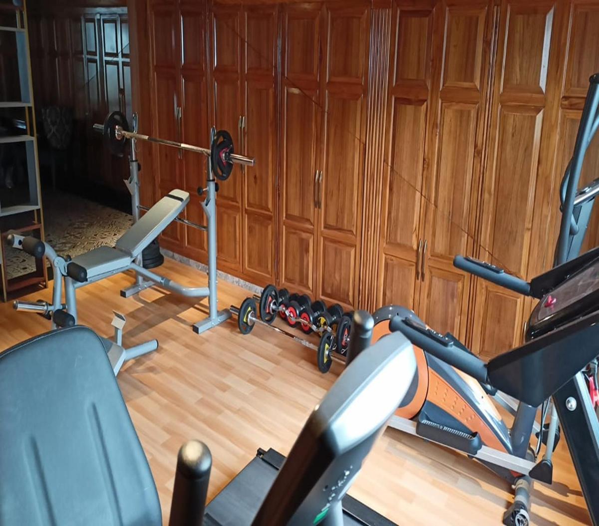 a gym with two exercise bikes in a room at WelcomHeritage Elysium Resort & Spa in Shimla