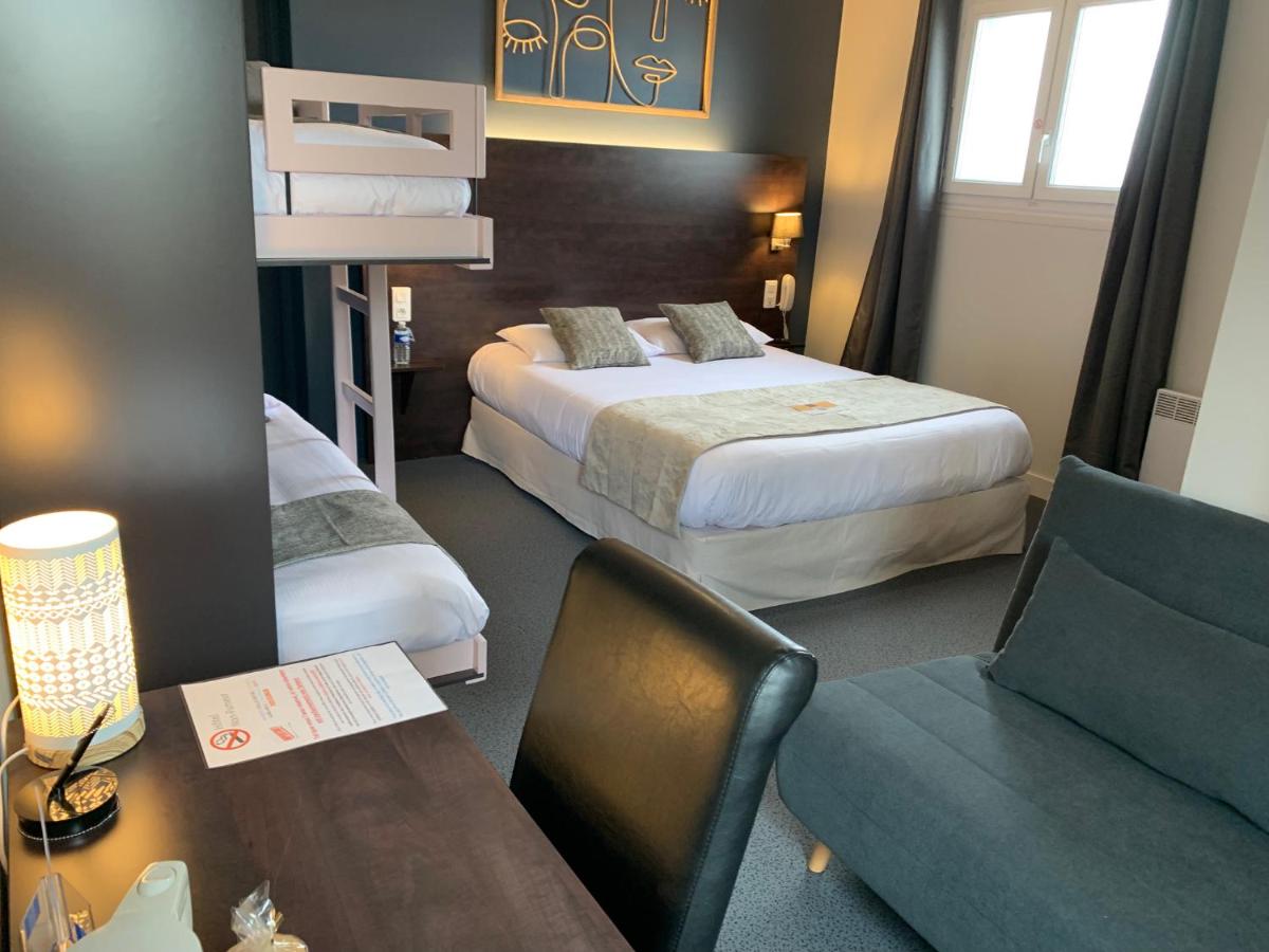 Un ou plusieurs lits dans un hébergement de l'établissement Logis hôtel Aux Berges de l'Aveyron
