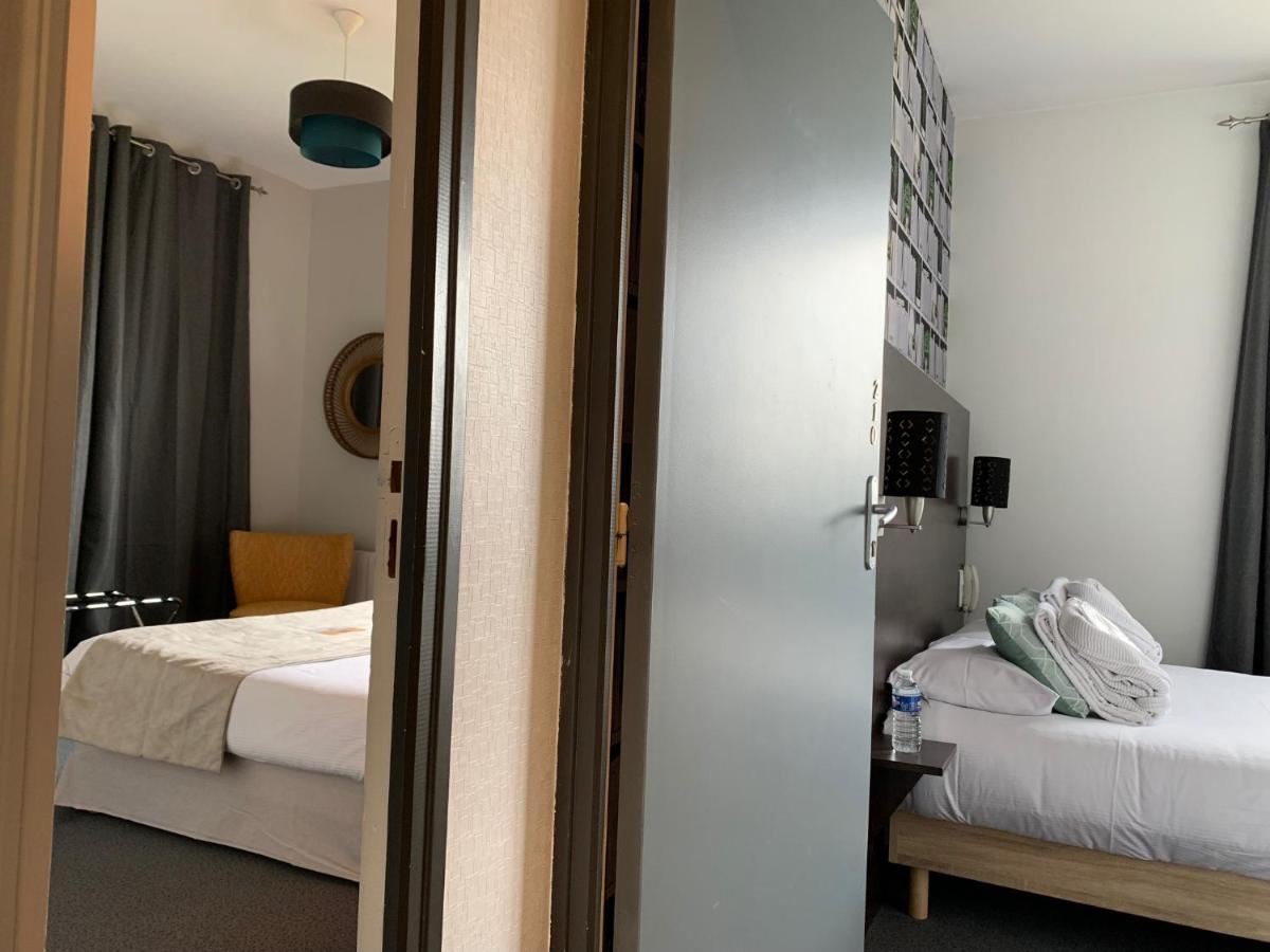 Un ou plusieurs lits dans un hébergement de l'établissement Logis hôtel Aux Berges de l'Aveyron