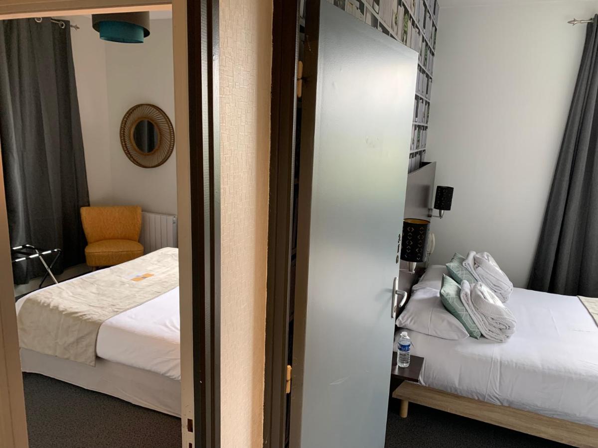 Un ou plusieurs lits dans un hébergement de l'établissement Logis hôtel Aux Berges de l'Aveyron