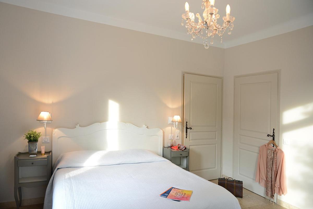 Un ou plusieurs lits dans un hébergement de l'établissement Hotel du Soleil et Spa