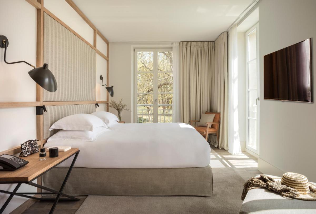 Un ou plusieurs lits dans un hébergement de l'établissement Le Grand Pavillon Chantilly