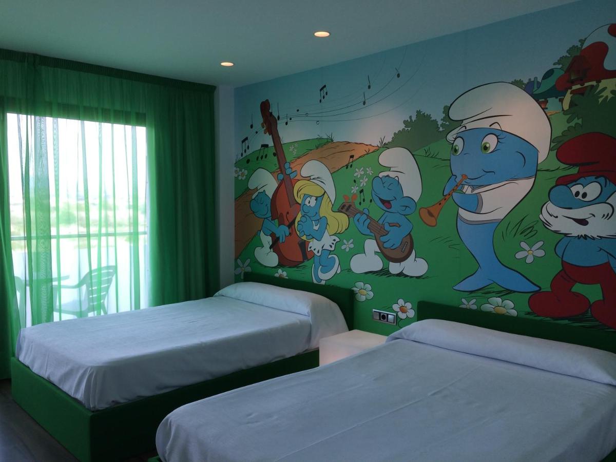 Cama o camas de una habitación en Hotel Acuazul