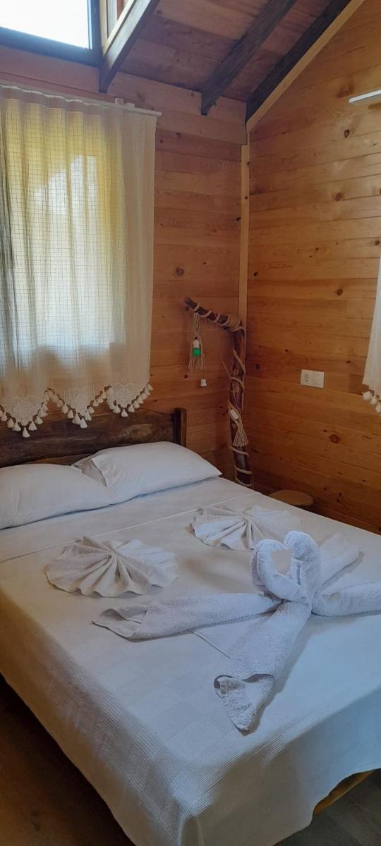 Colorful Bungalow Close to the Beach Surrounded by Nature with Jacuzzi and Backyard in Ciftlik Fethiye - Housity