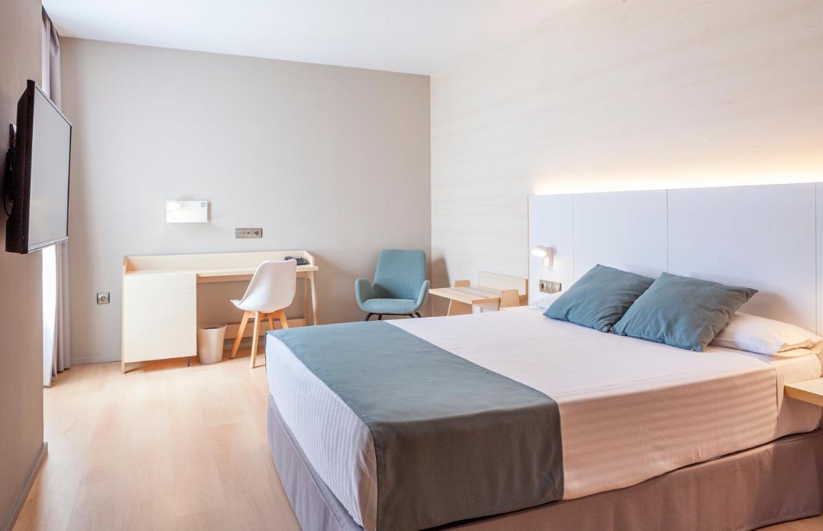 Cama o camas de una habitación en Hotel Olympia Valencia