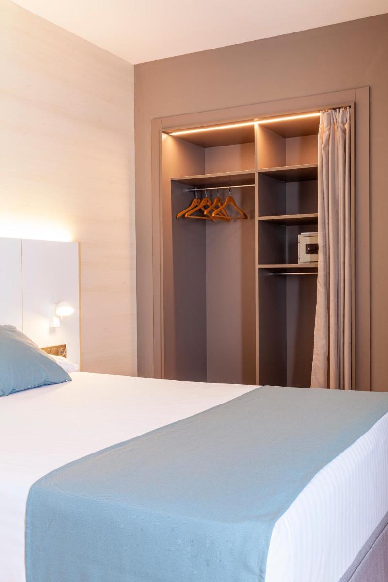Cama o camas de una habitación en Hotel Olympia Valencia