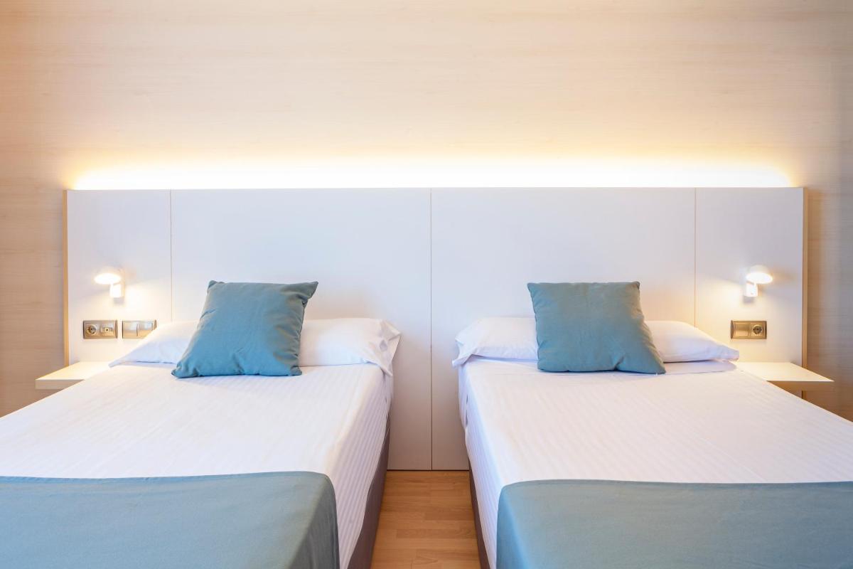 Cama o camas de una habitación en Hotel Olympia Valencia