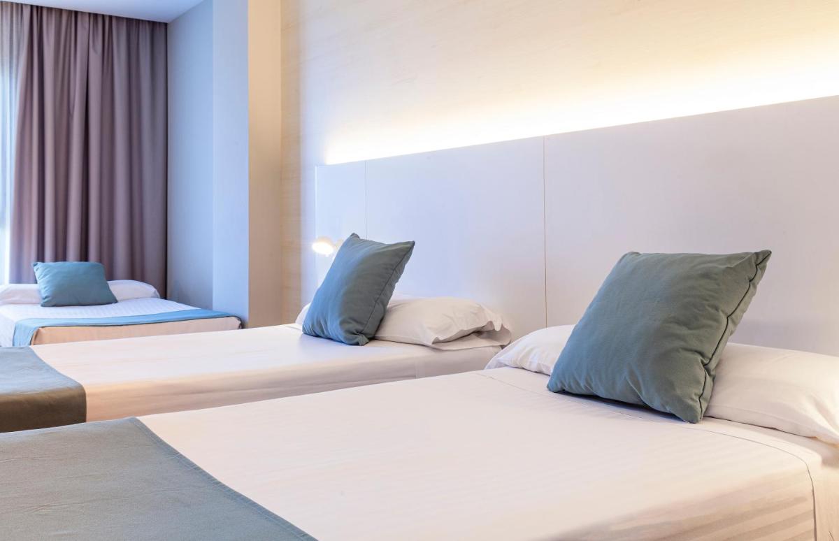 Cama o camas de una habitación en Hotel Olympia Valencia